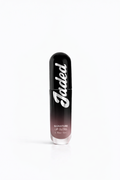 Lip gloss with 'Jaded' branding on a white background